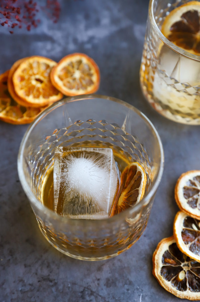 Photo of cocktail hour with oranges and mezcal