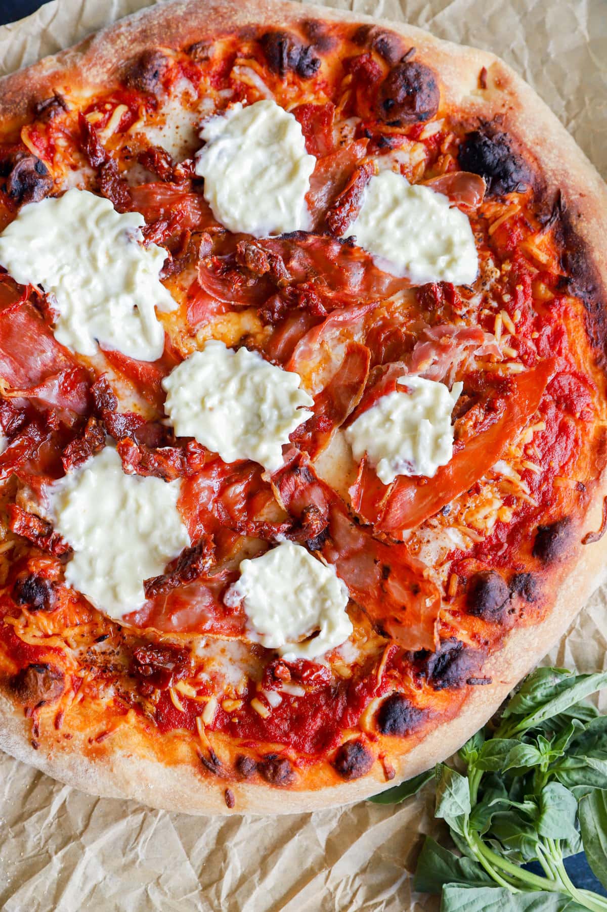topping pizza with burrata cheese image