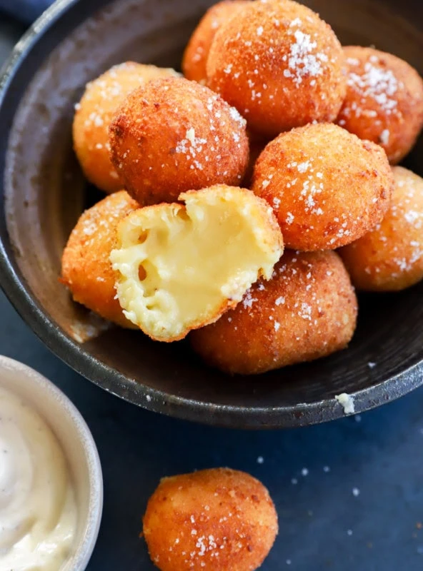 Seeing the gooey filling of the fried balls with salt on top and dipping sauce