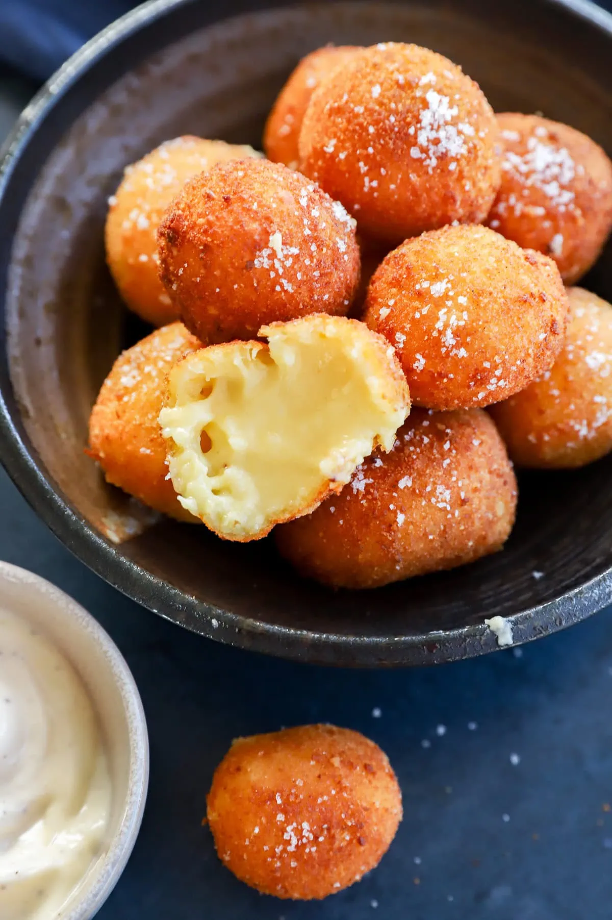 Seeing the gooey filling of the fried balls with salt on top and dipping sauce