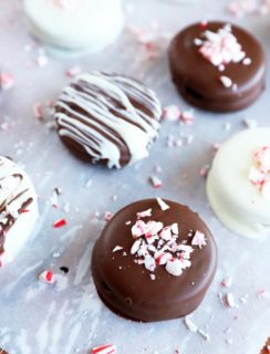 Chocolate covered oreos on parchment paper image