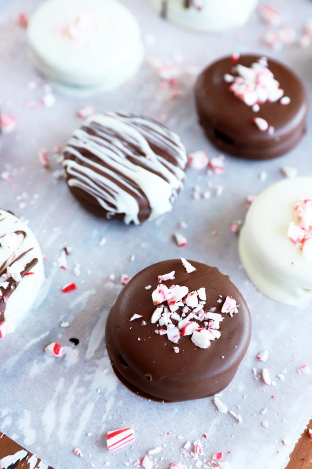 Chocolate covered oreos on parchment paper image