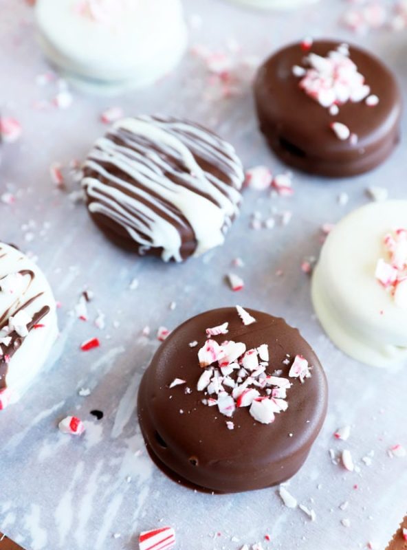 Chocolate covered oreos on parchment paper image