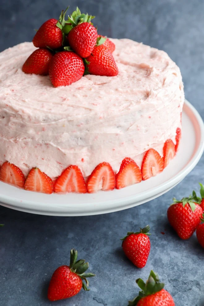 Strawberry Chocolate Cake on cake stand with fresh berries picture