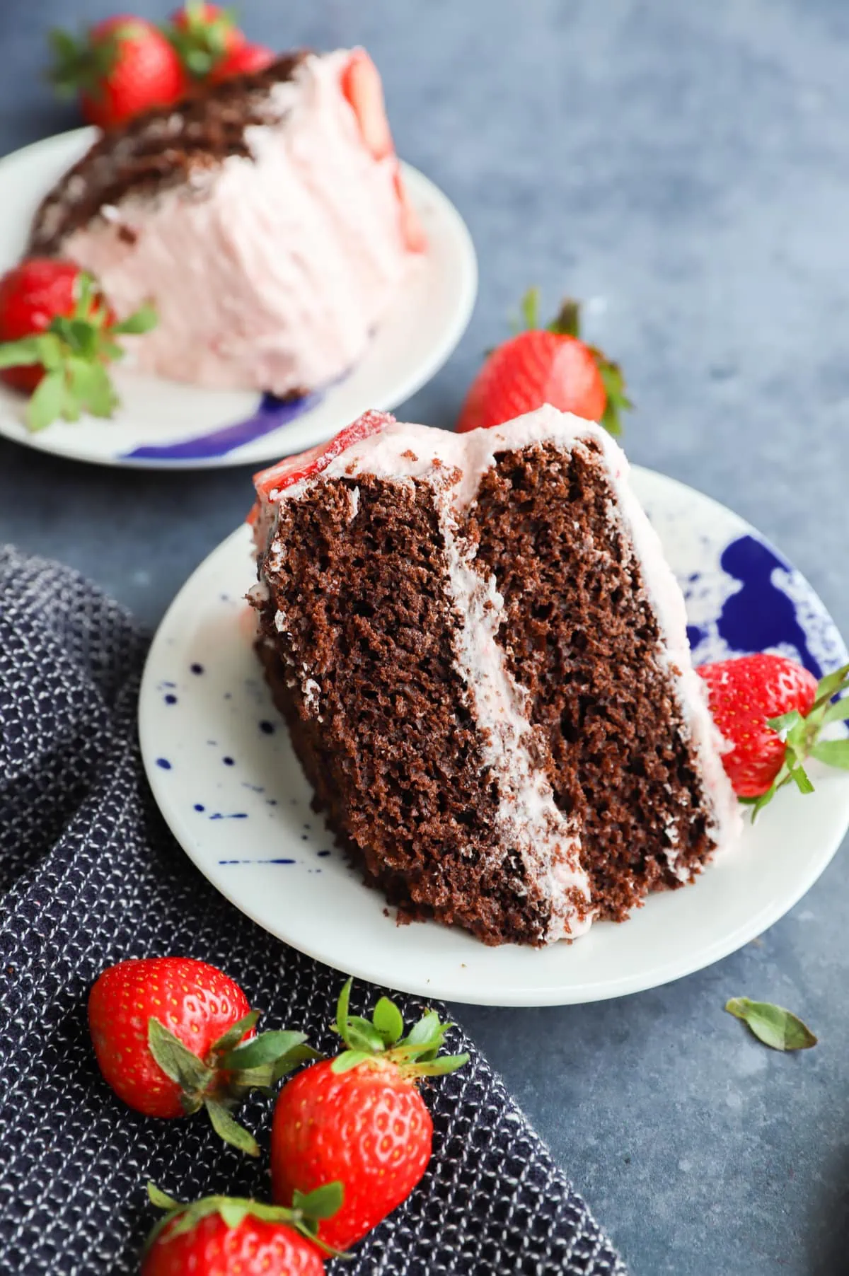 Picture of chocolate cake on plate with strawberries