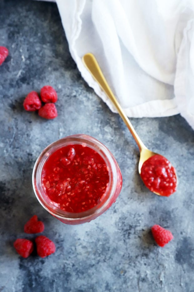 Overhead image of sauce on spoon and in jar