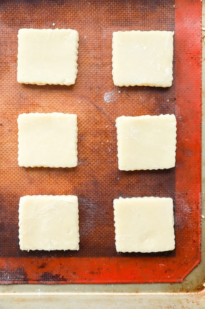 cut out holiday cookies on baking sheet