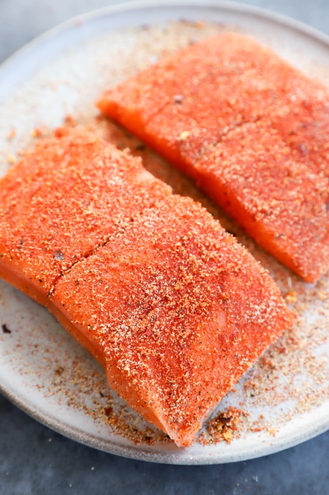 Image of salmon fillets rubbed with spice mixture