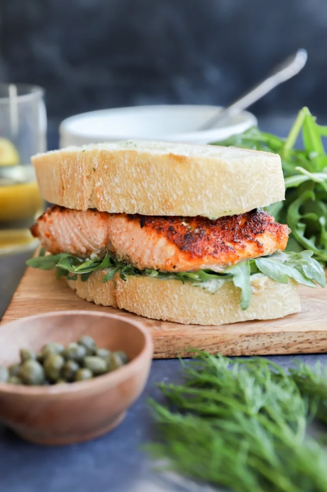 salmon sandwich recipe photo on platter with salad