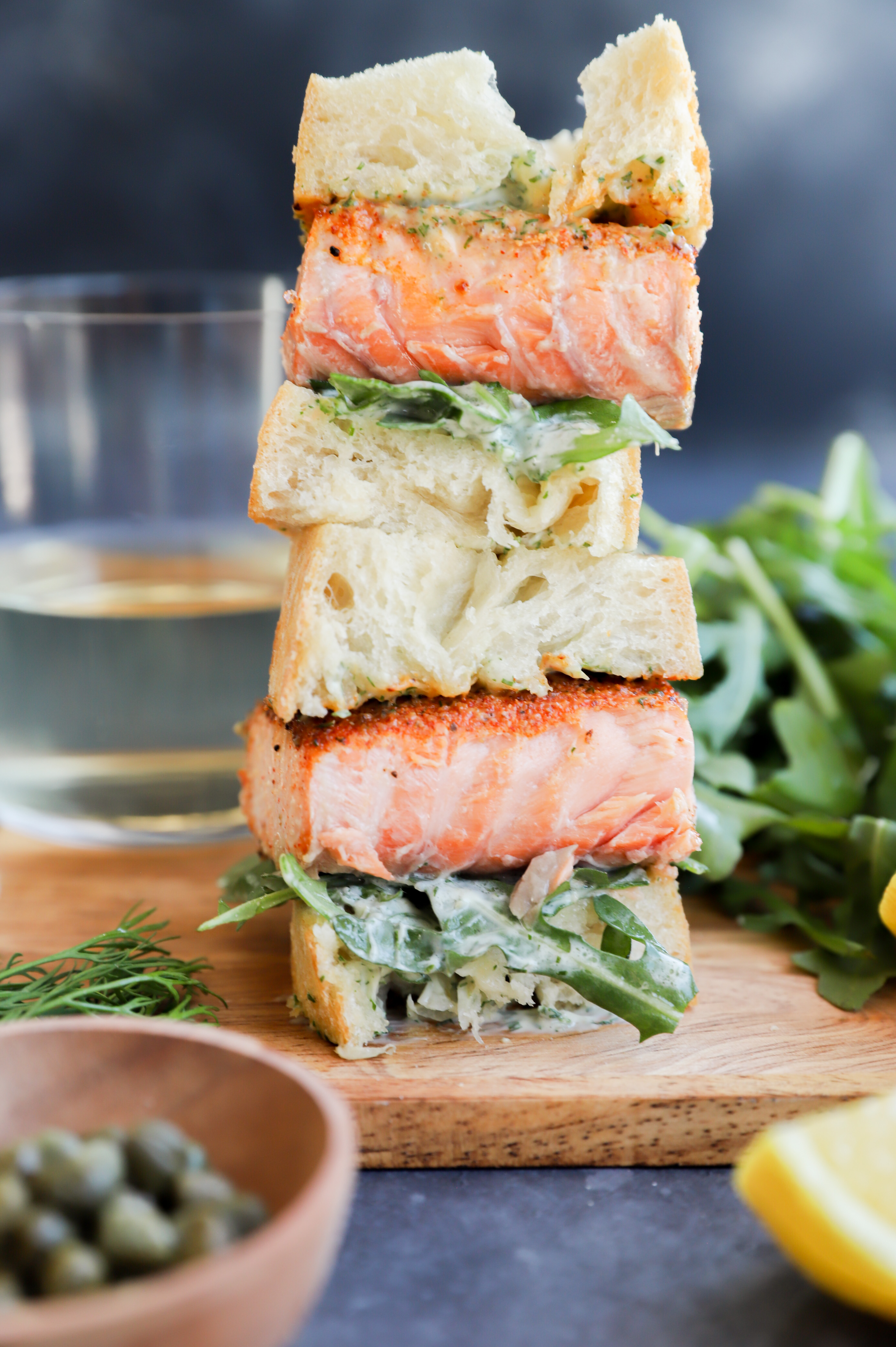 Side photo of salmon sandwich cut in half