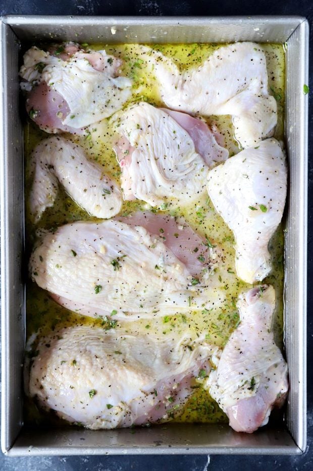 Raw chicken in a roasting pan