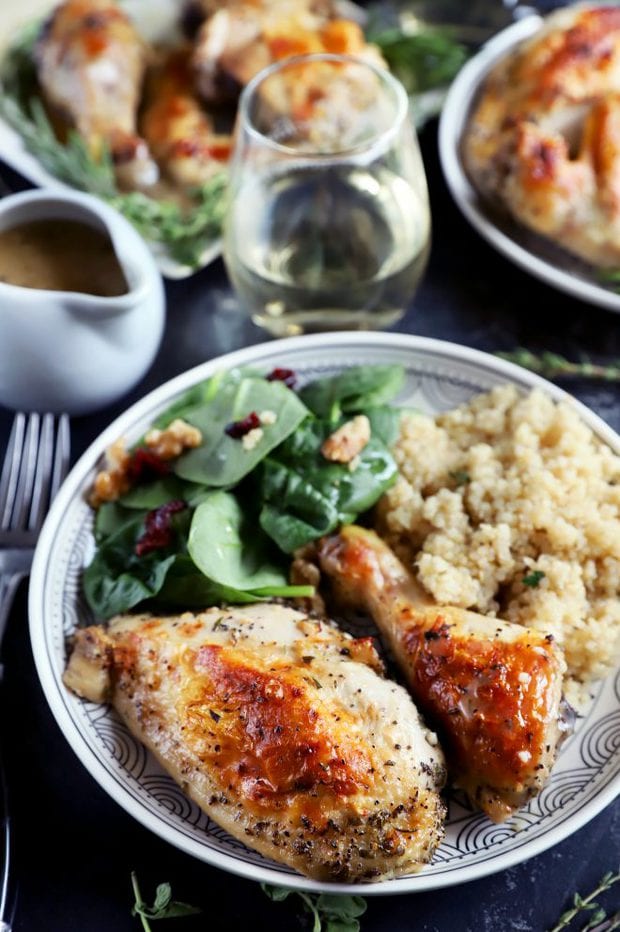 Side shot of chicken breast and leg on a plate