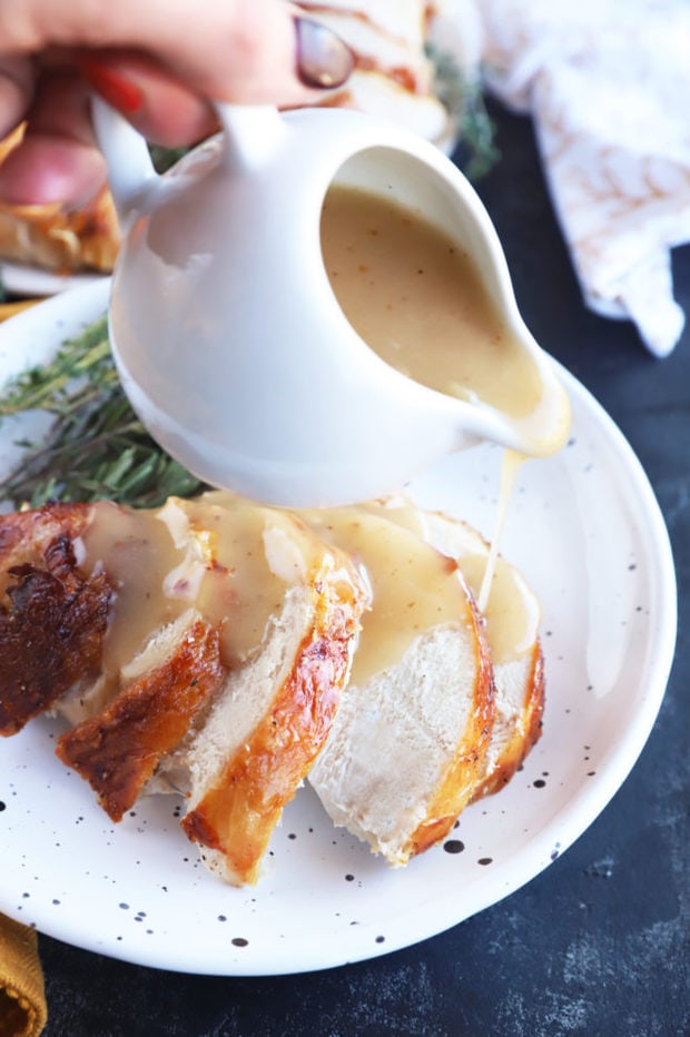 Pouring gravy on thanksgiving turkey image