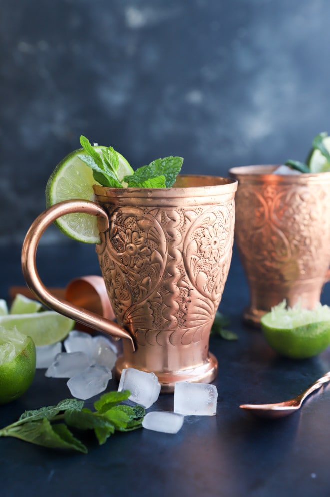 Floral copper mugs and ingredients for kentucky mule