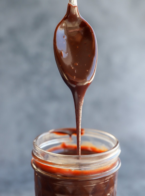 drizzling chocolate sauce into a jar image