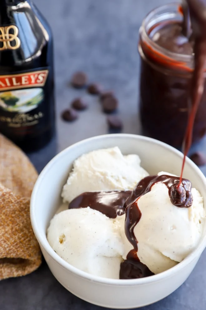 drizzling hot fudge sauce over ice cream picture