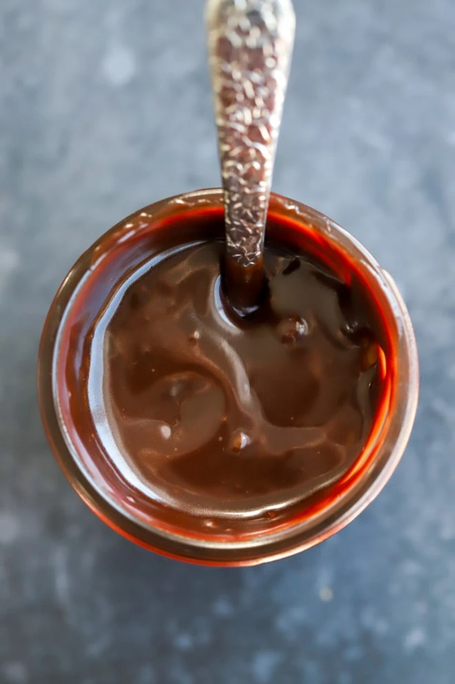 Overhead image of baileys hot fudge sauce in jar