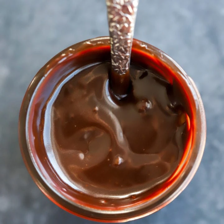 Overhead image of baileys hot fudge sauce in jar