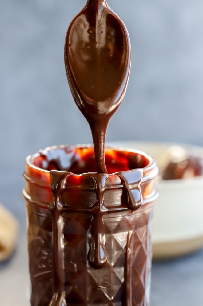 Spoon of hot fudge sauce with baileys image