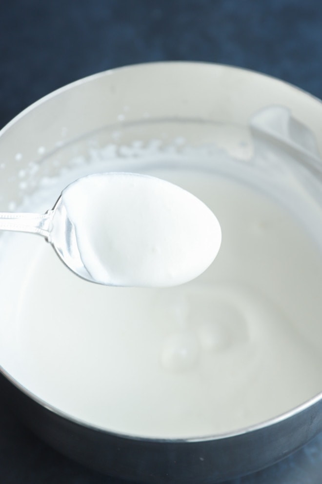 lightly whipped cream in a bowl with a spoon