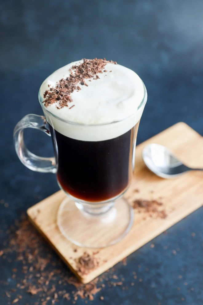 classic Irish coffee in clear mug with topping