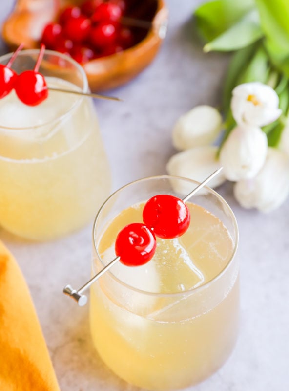 Cherries on cocktail glasses image