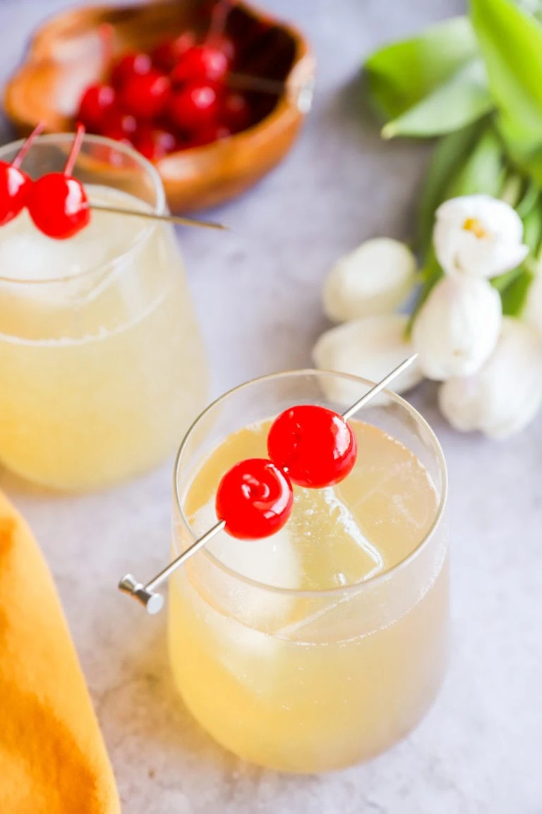 Cherries on cocktail glasses image