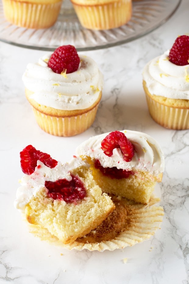 Lemon Raspberry Filled Cupcakes with White Chocolate Buttercream Frosting | cakenknife.com