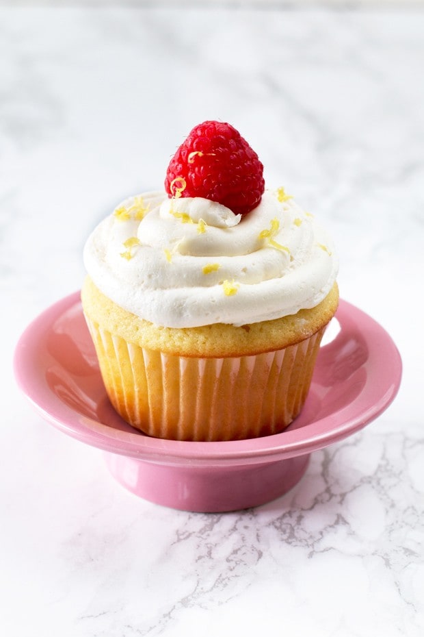 Lemon Raspberry Filled Cupcakes with White Chocolate Buttercream Frosting | cakenknife.com