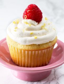 Lemon Raspberry-Filled Cupcakes with White Chocolate Buttercream Frosting | cakenknife.com