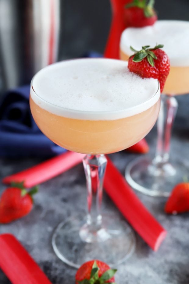 Strawberry Rhubarb Gin Fizz Cocktail in a coupe glass