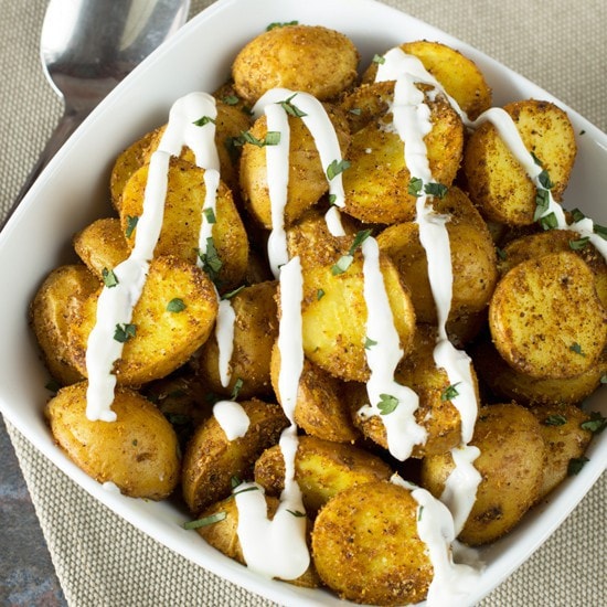 Roasted Curry Potatoes with Greek Yogurt Sauce | cakenknife.com