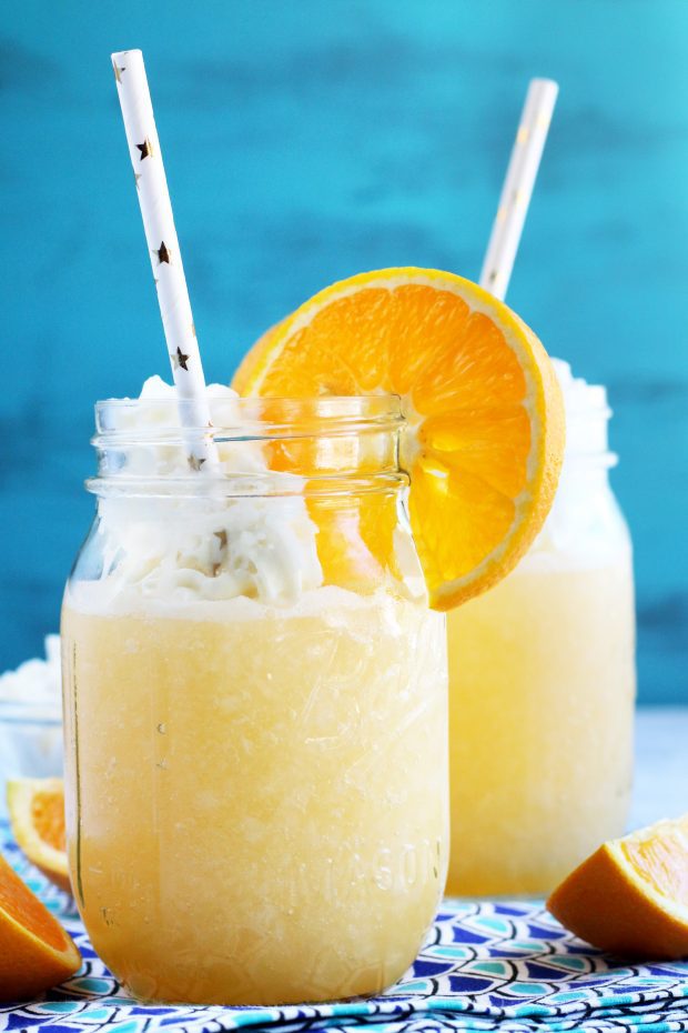 Picture of orange cocktail in two mason jars