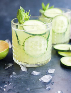 Vegetable tequila cocktail in glasses with mint sprigs