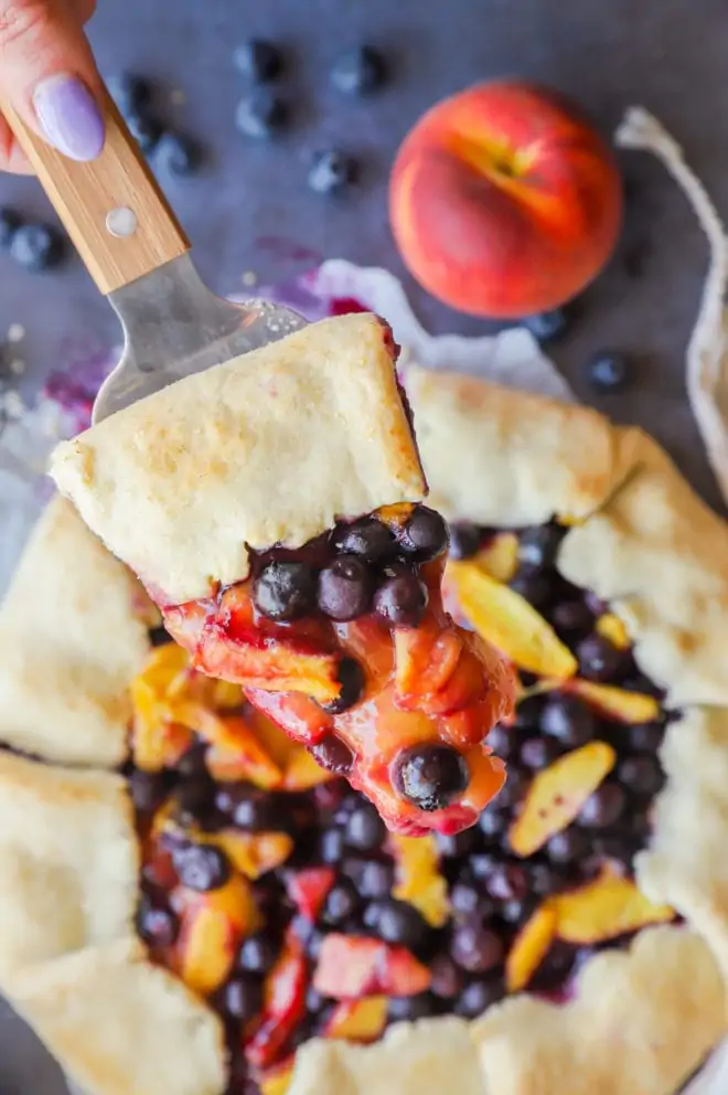 Picture of holding slice of galette with fresh fruit