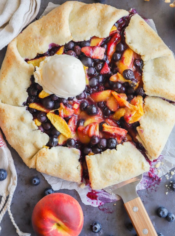 Peach blueberry galette with ice cream image