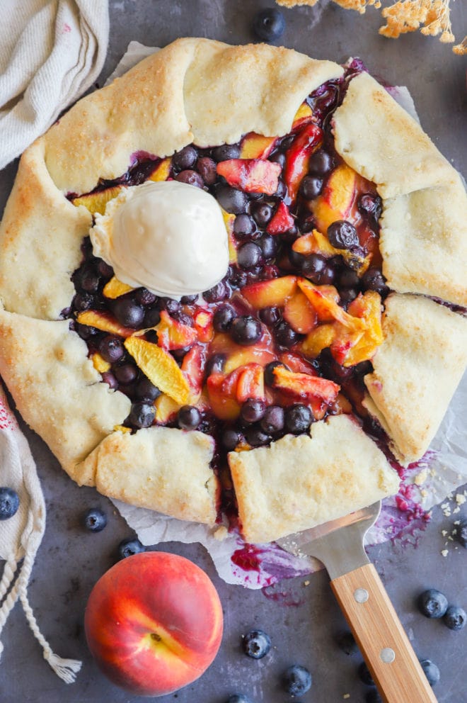 Peach blueberry galette with ice cream image