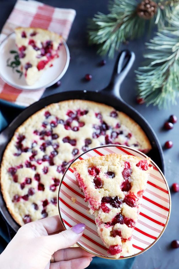 Holiday dessert slice with cranberries on a plate image