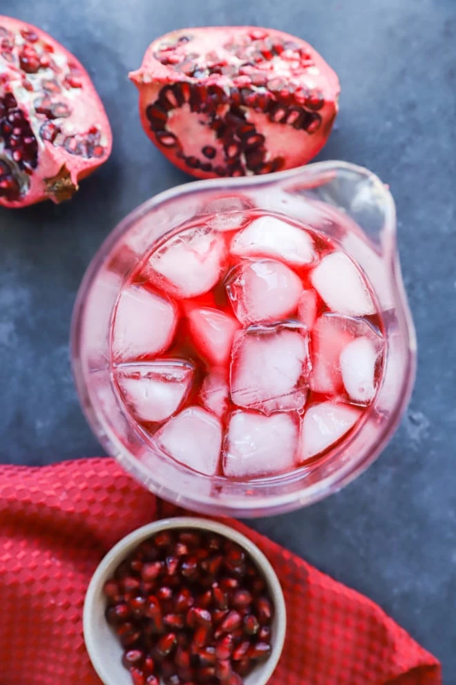 making a pomegranate negroni cocktail