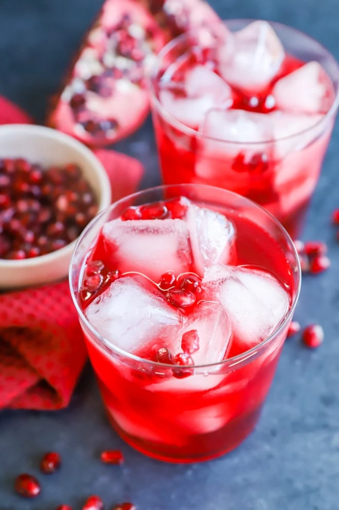 pomegranate cocktail in glasses with pomegranate seeds