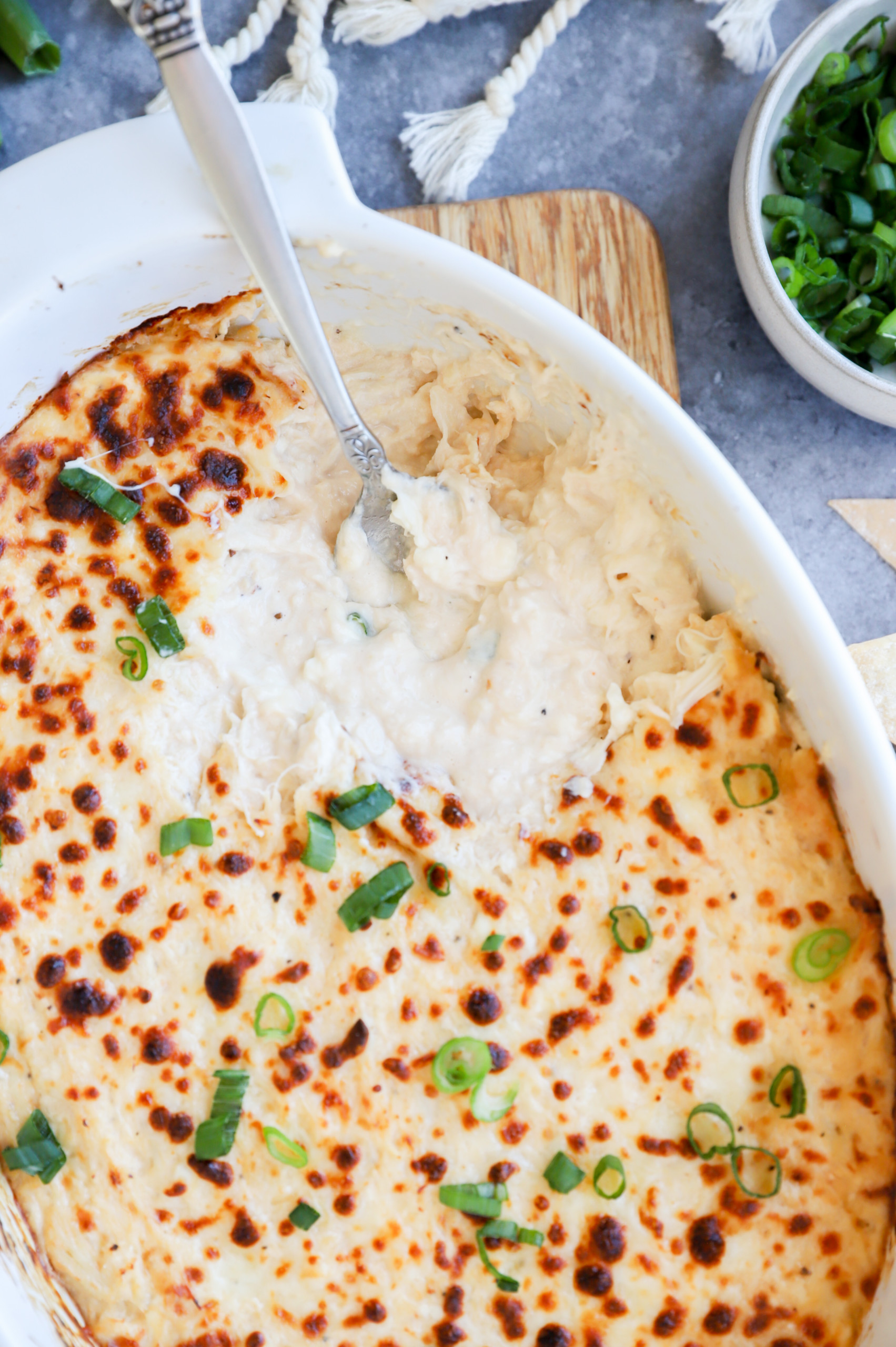 Spoon in crab rangoon dip in casserole dish picture