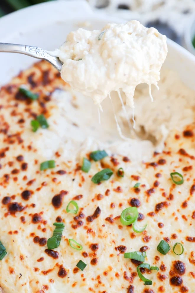 Spoon lifting out crab rangoon dip image