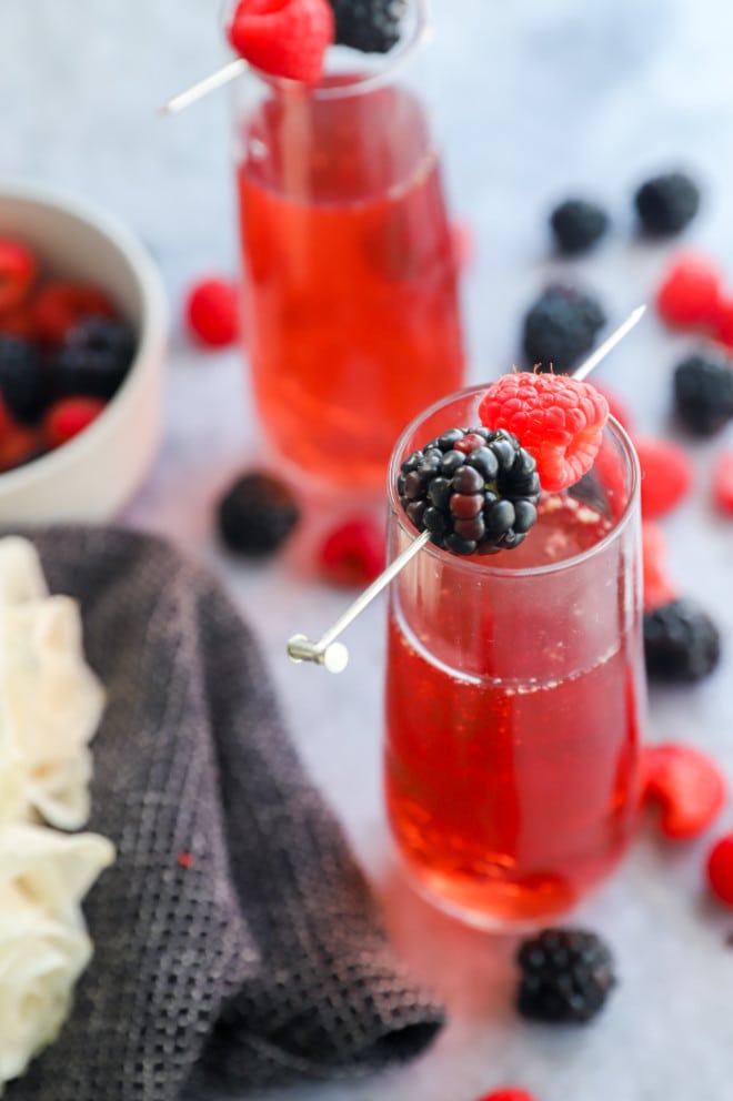 Photo of champagne glasses with berries and sparkling sangria