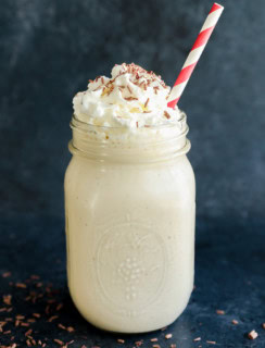 baileys coffee milkshake in mason jar with whipped cream and chocolate shavings