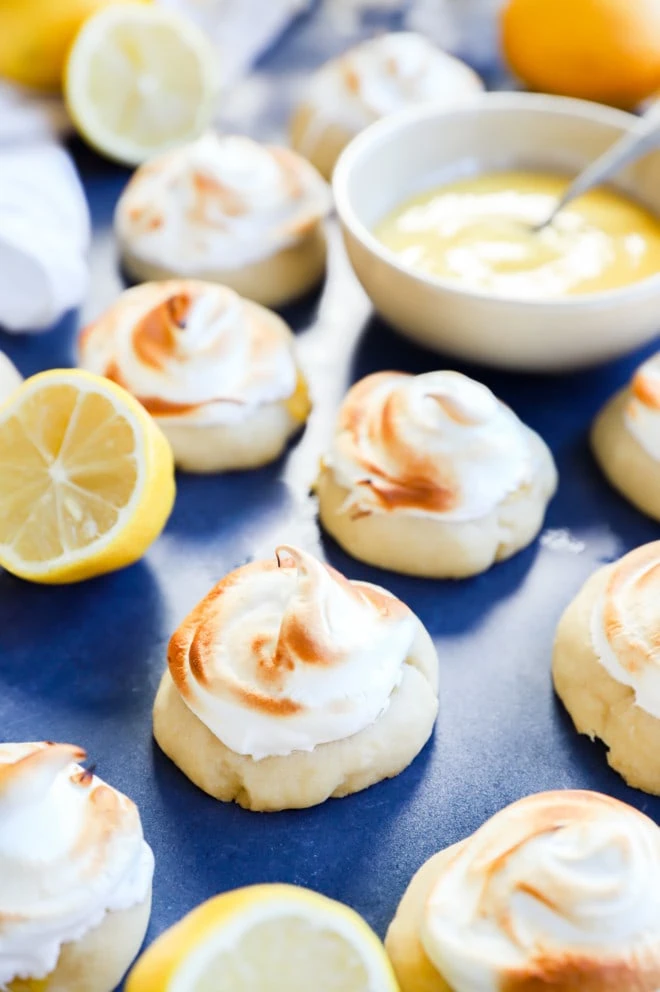 lemon curd cookies with meringue topping and lemon curd in a bowl