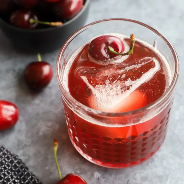 Fresh cherry cocktail in glass with fruit image