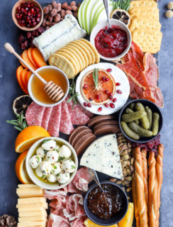 Assembled christmas cheese board on slate plate