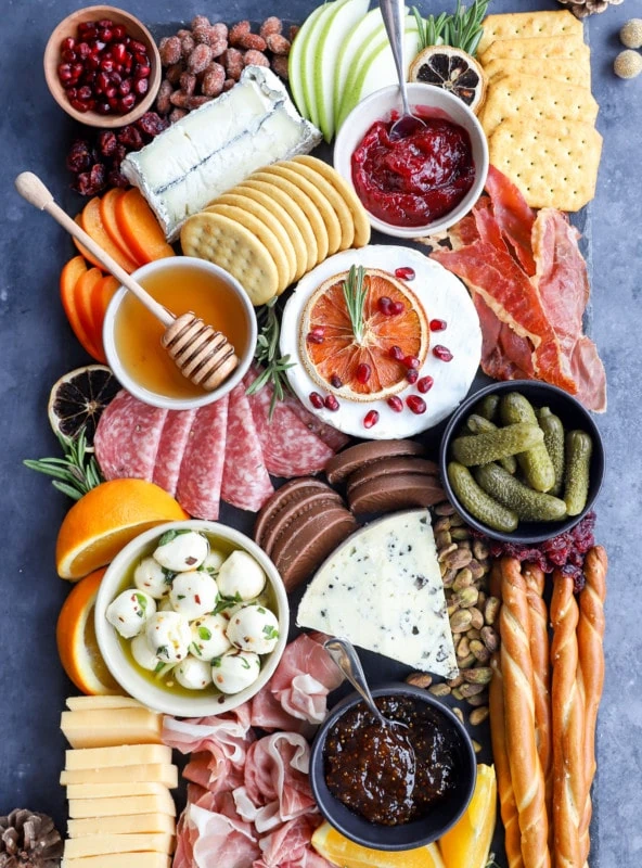 Assembled christmas cheese board on slate plate