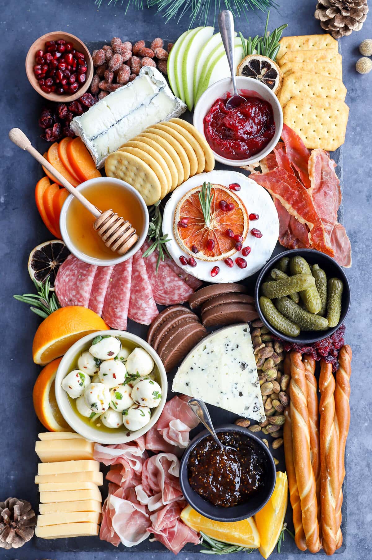 Assembled christmas cheese board on slate plate