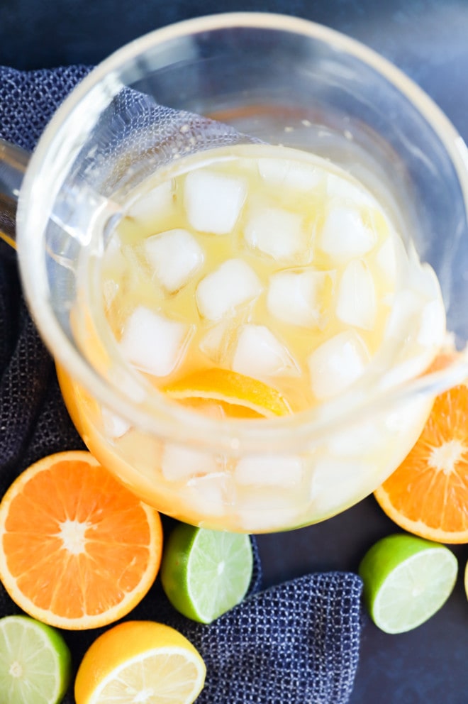 making spiced rum punch in a pitcher